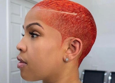 Sleek red hairstyle at Le Brand 254, Nairobi, Nairobi County, KE. Perfect for bold, modern looks.