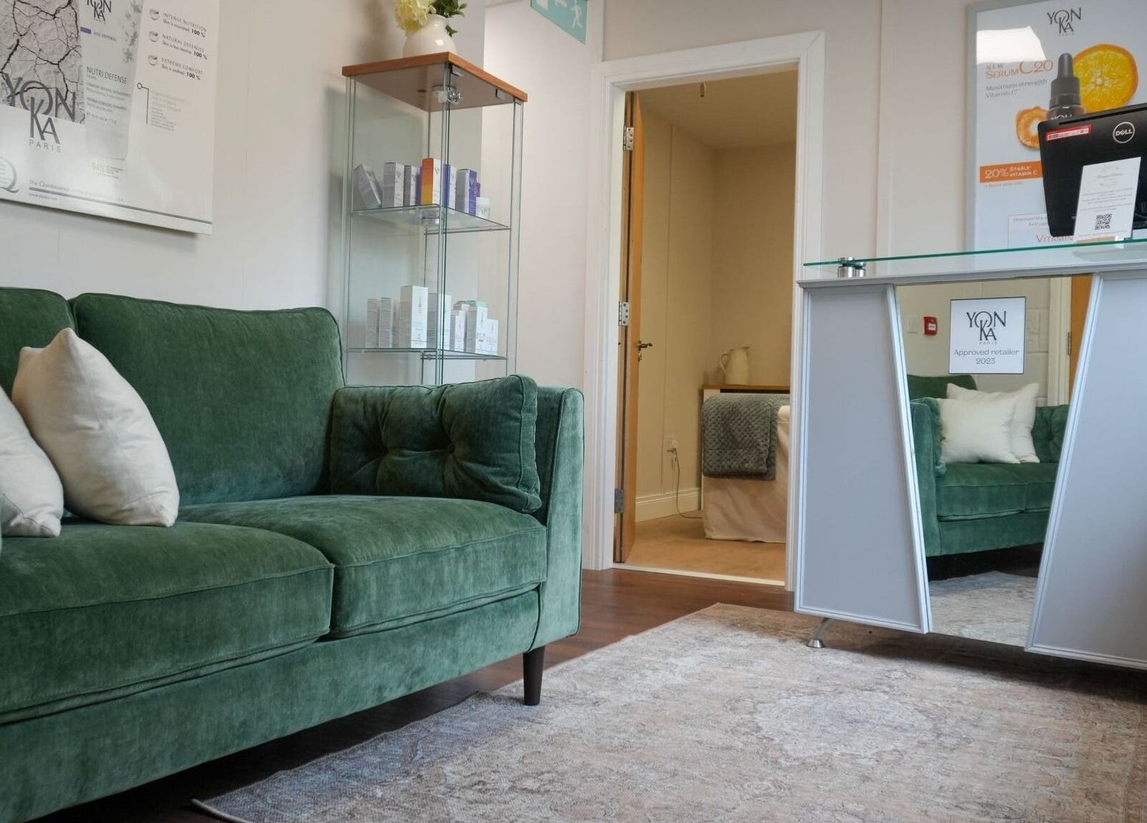 Welcoming lounge with green sofa at Tranquil Beauty By Teresa in Castlewellan, Northern Ireland, GB.