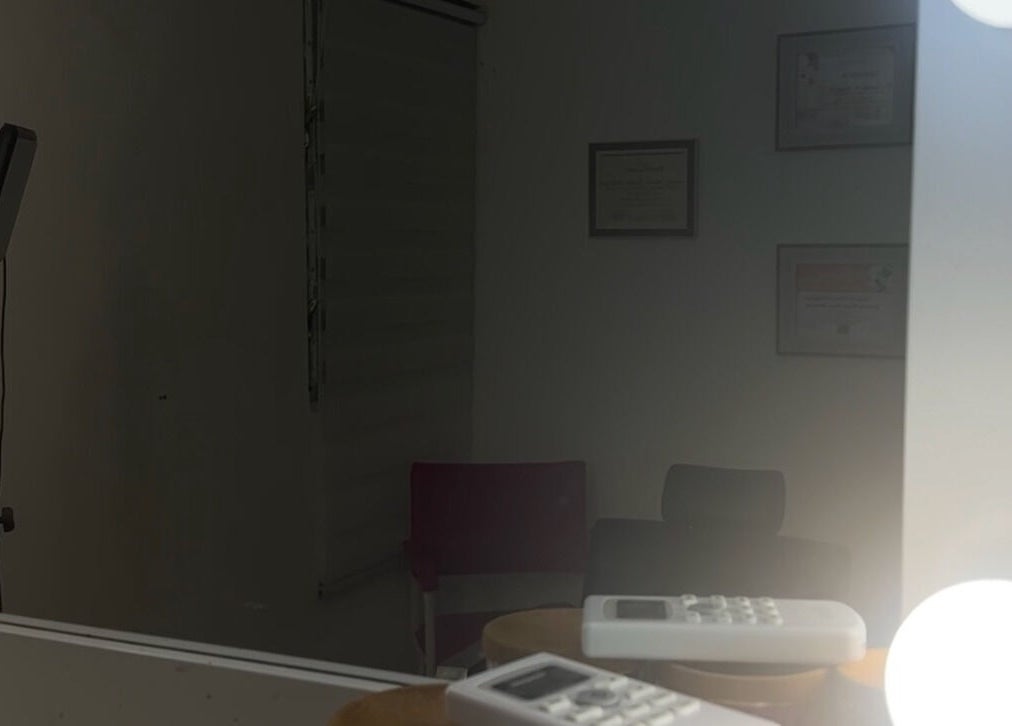 Illuminated mirror at MCmakeup Caronlay studio in Santo Domingo Este, Santo Domingo, DO with cozy seating.