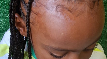 Detailed view of braided hairstyle at The Hair Fairy, Willemstad, Curaçao, CW showcasing intricate braiding.
