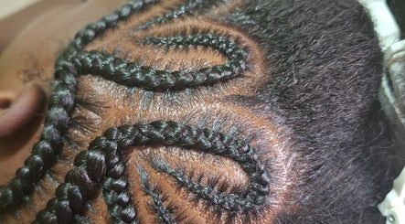 Intricate braided hairstyle at The Hair Fairy, Willemstad, Curaçao, CW showcasing detailed craftsmanship.