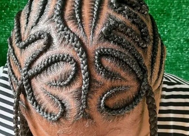 Intricate braided hairstyle at The Hair Fairy, Willemstad, Curaçao, CW, showcasing artistic design.