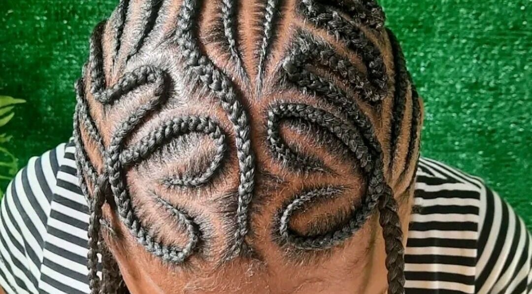 Intricate braided hairstyle at The Hair Fairy, Willemstad, Curaçao, CW, showcasing artistic design.