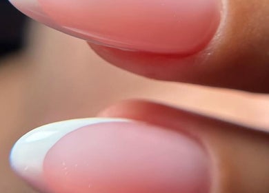 Close-up of a French manicure at MELGANAILS, دبي, دبي, AE showcasing elegance and precision.