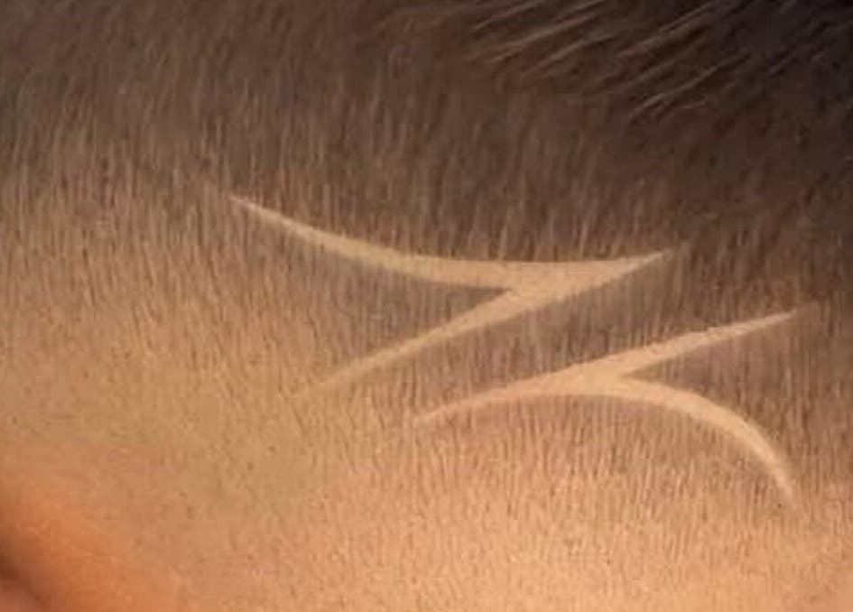 Creative hair design at Moe Studio, Ottawa, Ontario, CA, showcasing intricate shaved patterns.