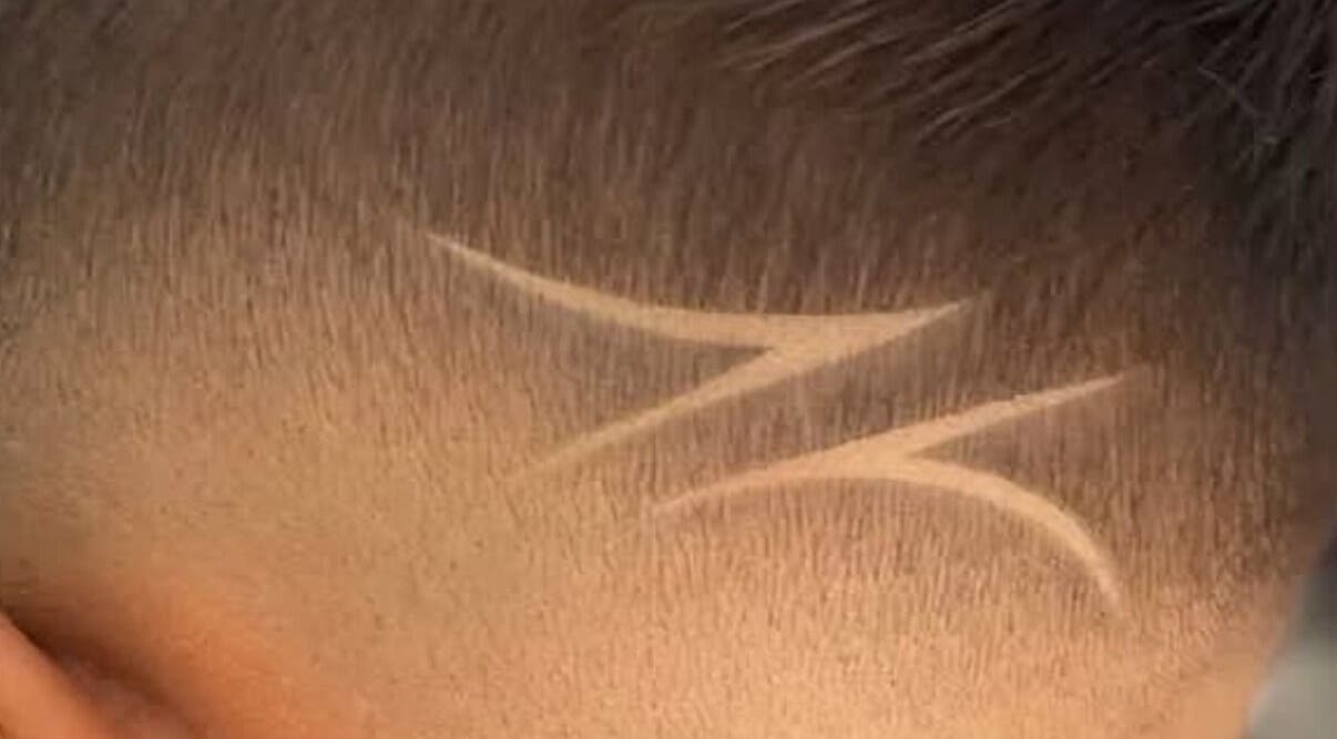 Creative hair design at Moe Studio, Ottawa, Ontario, CA, showcasing intricate shaved patterns.