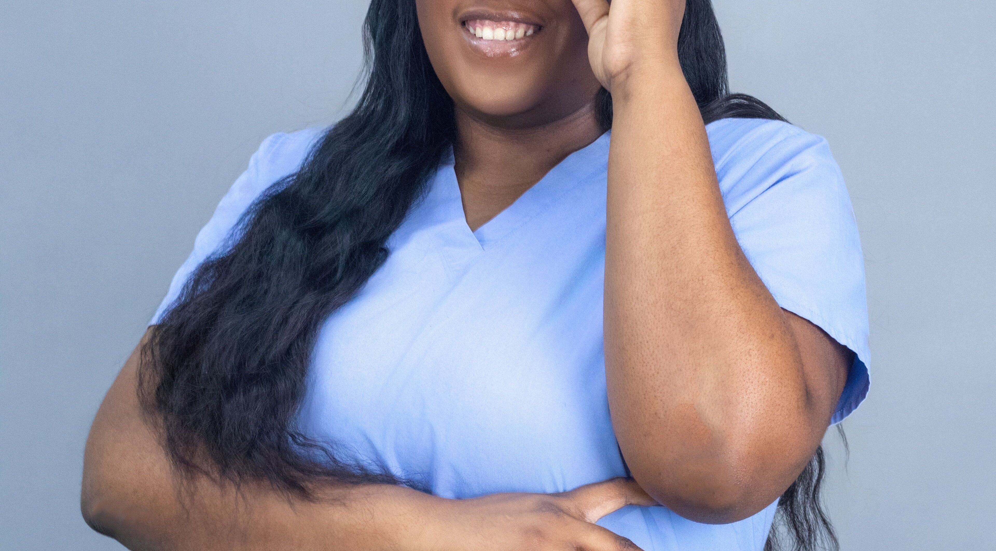 Smiling professional at The Derma Luxe Institute Clinical Spa, Chaguanas, Chaguanas, TT.