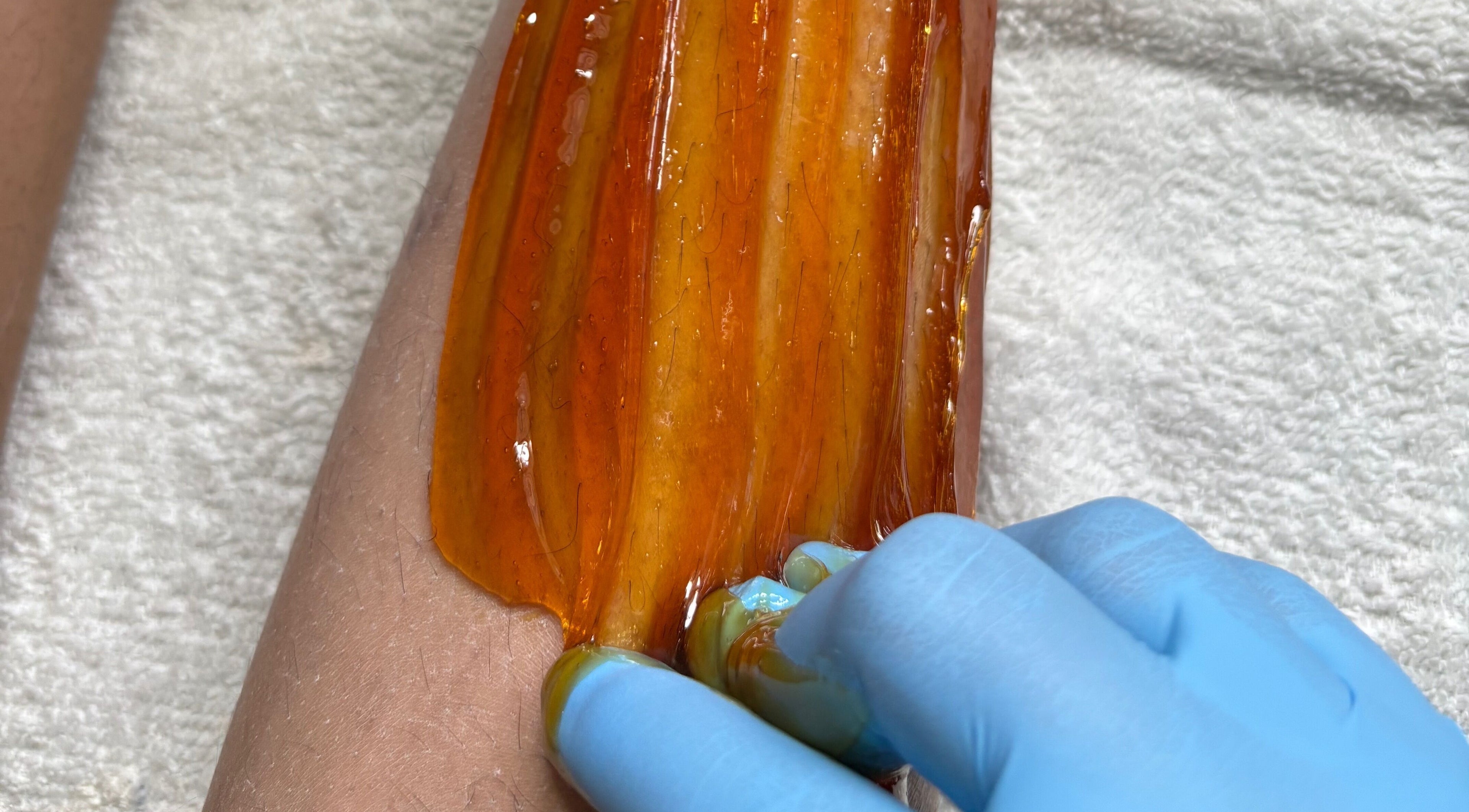 Honey waxing on arm at Bree's Honey Bar CW, Willemstad, Curaçao, CW. Relaxing wellness experience.