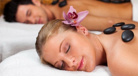 Couple enjoying hot stone therapy at Great Life Oriental Therapy Massage in Macomb, Michigan, US.