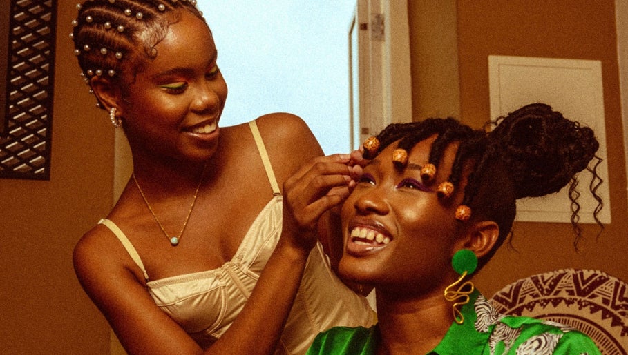 Two women enjoying a beauty session at Urban Roots co, CW, showcasing vibrant style and happiness.