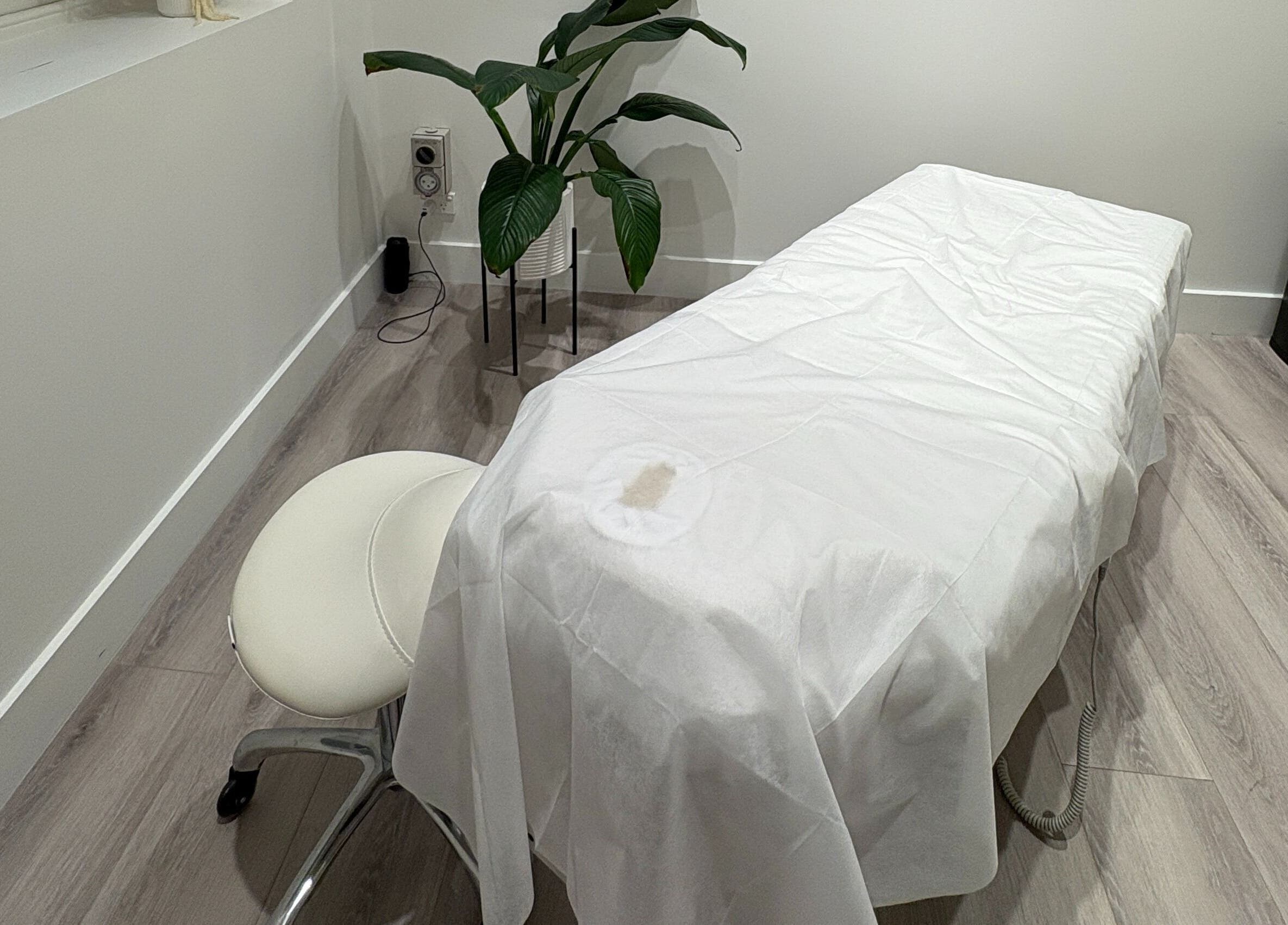 Tranquil treatment room with a massage table at Keenest Studio in Melbourne, Victoria, AU.