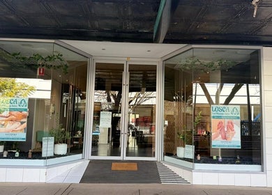 Entrance of Losca Body & Foot Massage in Shepparton, Victoria, AU with vibrant display and open signage.