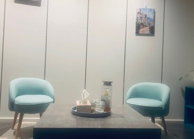 Cozy waiting area at Losca Body & Foot Massage, Shepparton, Victoria, AU with soft blue chairs.