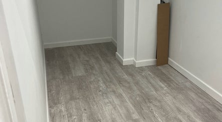 Minimalist room at Beauty by Abigail Jessica, Chesterfield, England, GB features sleek flooring and clean walls.