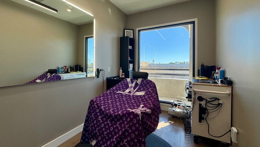 Elegant salon chair at Drip Hq in Garden Grove, California, US with modern decor and window view.