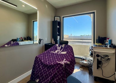 Elegant salon chair at Drip Hq in Garden Grove, California, US with modern decor and window view.
