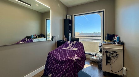 Elegant salon chair at Drip Hq in Garden Grove, California, US with modern decor and window view.