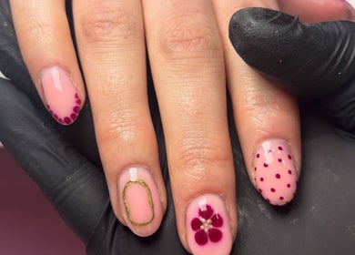 Intricate nail art at The Country Beauty Barn, Castlederg, Northern Ireland, GB with flower and polka dot designs.