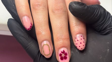 Intricate nail art at The Country Beauty Barn, Castlederg, Northern Ireland, GB with flower and polka dot designs.