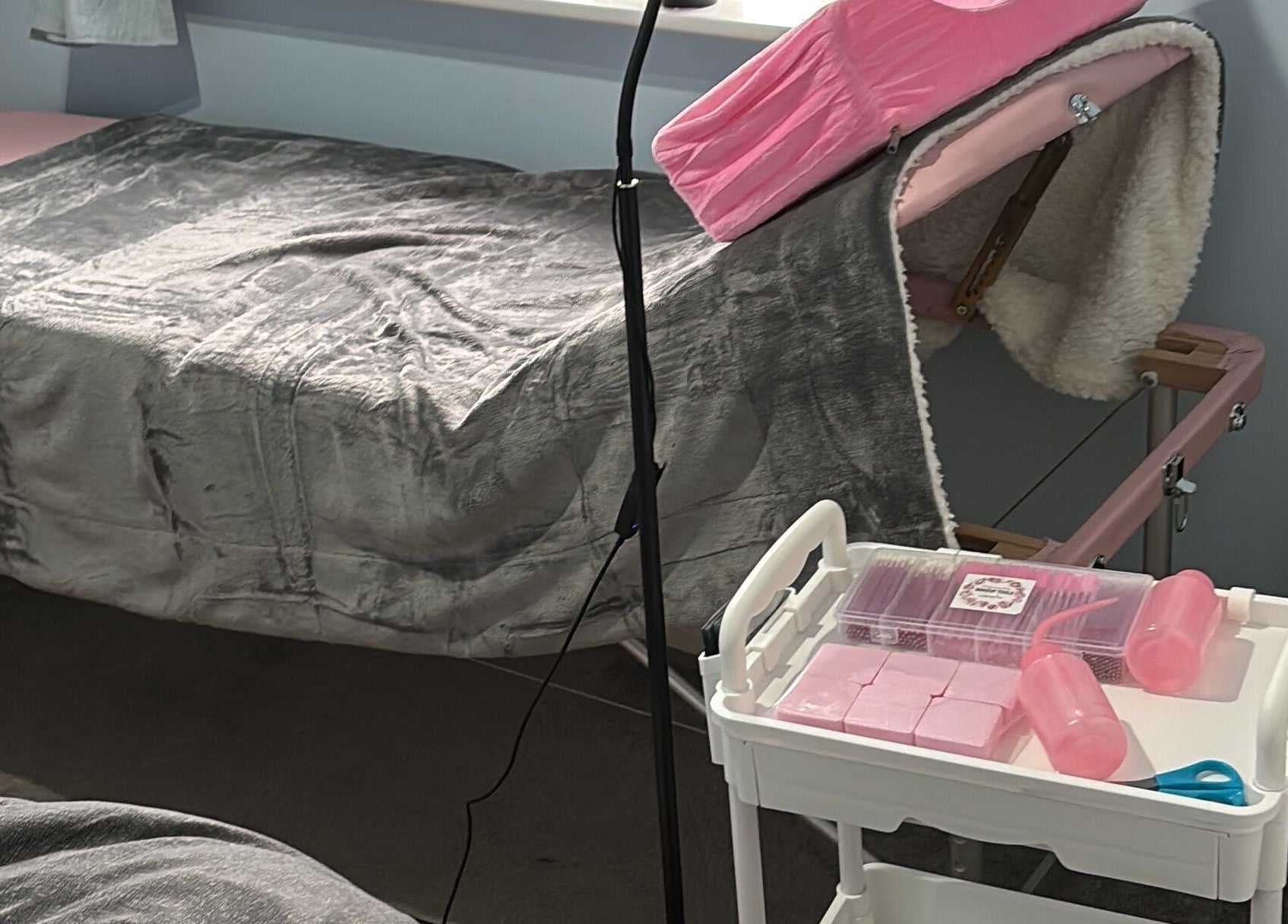 Luxurious lash room setup at Live Love Lash, Bicester, England, GB, featuring a cozy treatment bed and tools.