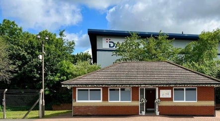 Haus of whites venue in Hilton, England, GB with lush greenery and a welcoming entrance.