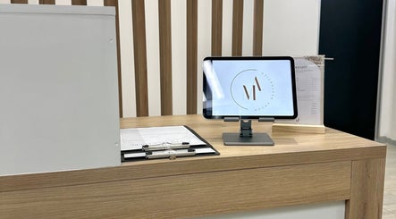 Reception desk at Mocha Aesthetics Clinic in Johannesburg, Gauteng, ZA with modern tablet display.