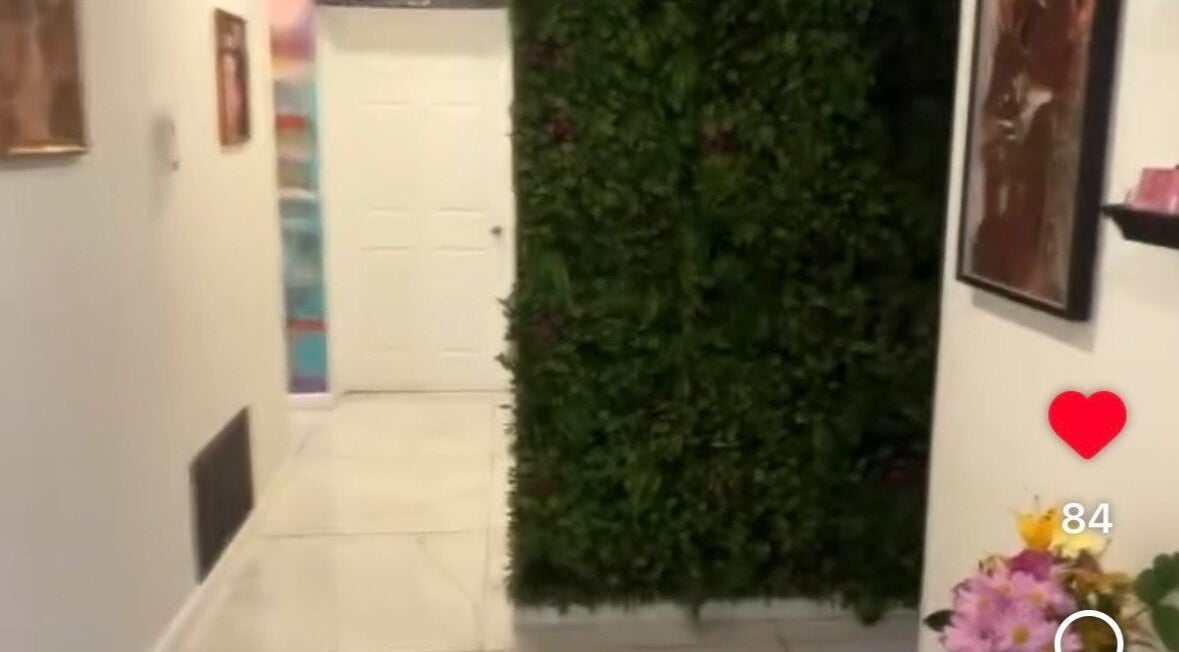 Elegant hallway with greenery at Pink Lounge Lash | PMU, Louisville, Kentucky, US.