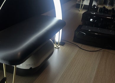 Sleek nail station lighting at Underthelamp.liv, Birmingham, England, GB, enhancing manicure process.