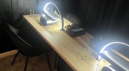 Elegant nail salon setup at Underthelamp.liv, Birmingham, England, GB featuring modern lighting and sleek design.