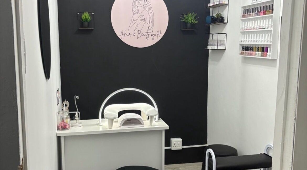 Modern nail station at Hair and Beauty By H in Cape Town, Western Cape, ZA with polish display and decor.
