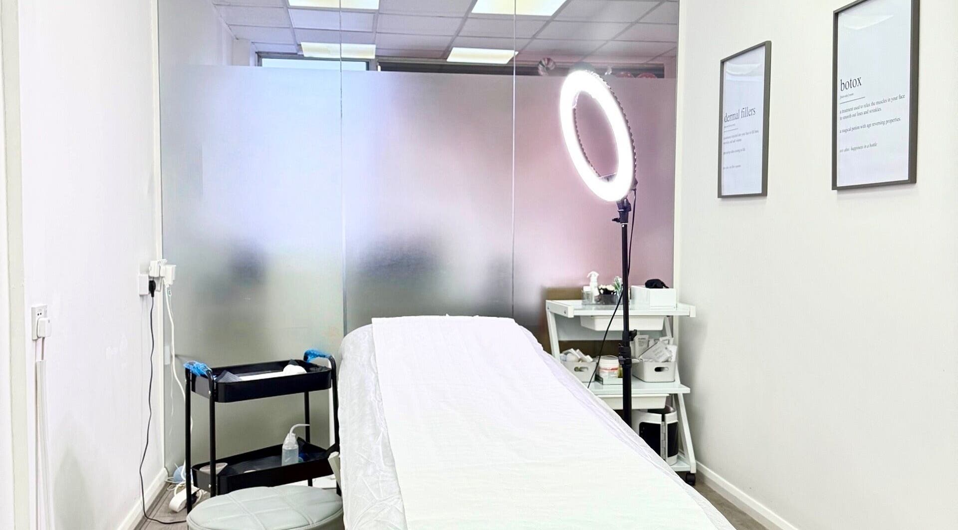 Relaxing treatment room at Katerina Aesthetics, Sidcup, England, GB with a comfortable bed and soft lighting.