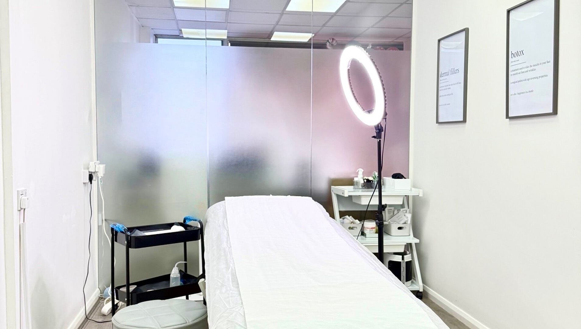 Treatment room at Katerina Aesthetics, Sidcup, England, GB, featuring a soothing ambiance and professional setup.