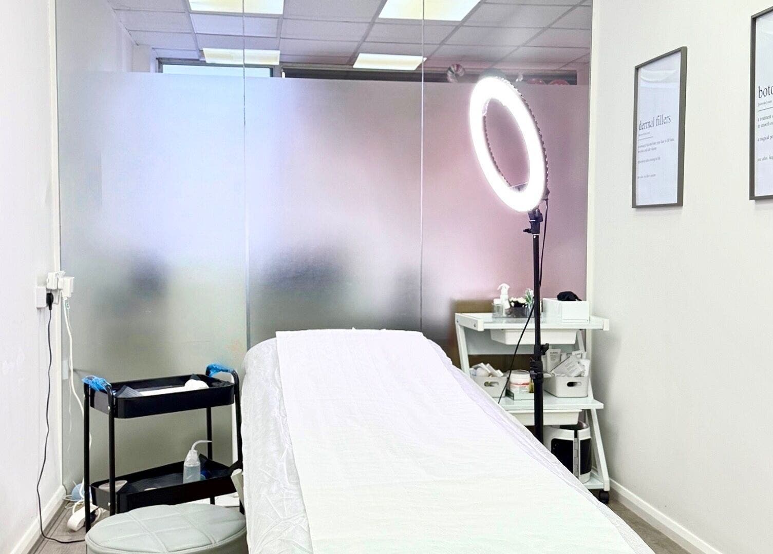 Treatment room at Katerina Aesthetics, Sidcup, England, GB, featuring a soothing ambiance and professional setup.