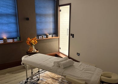 Cozy massage room with soft lighting at Elysium Massage Abergavenny, Abergavenny, Wales, GB.