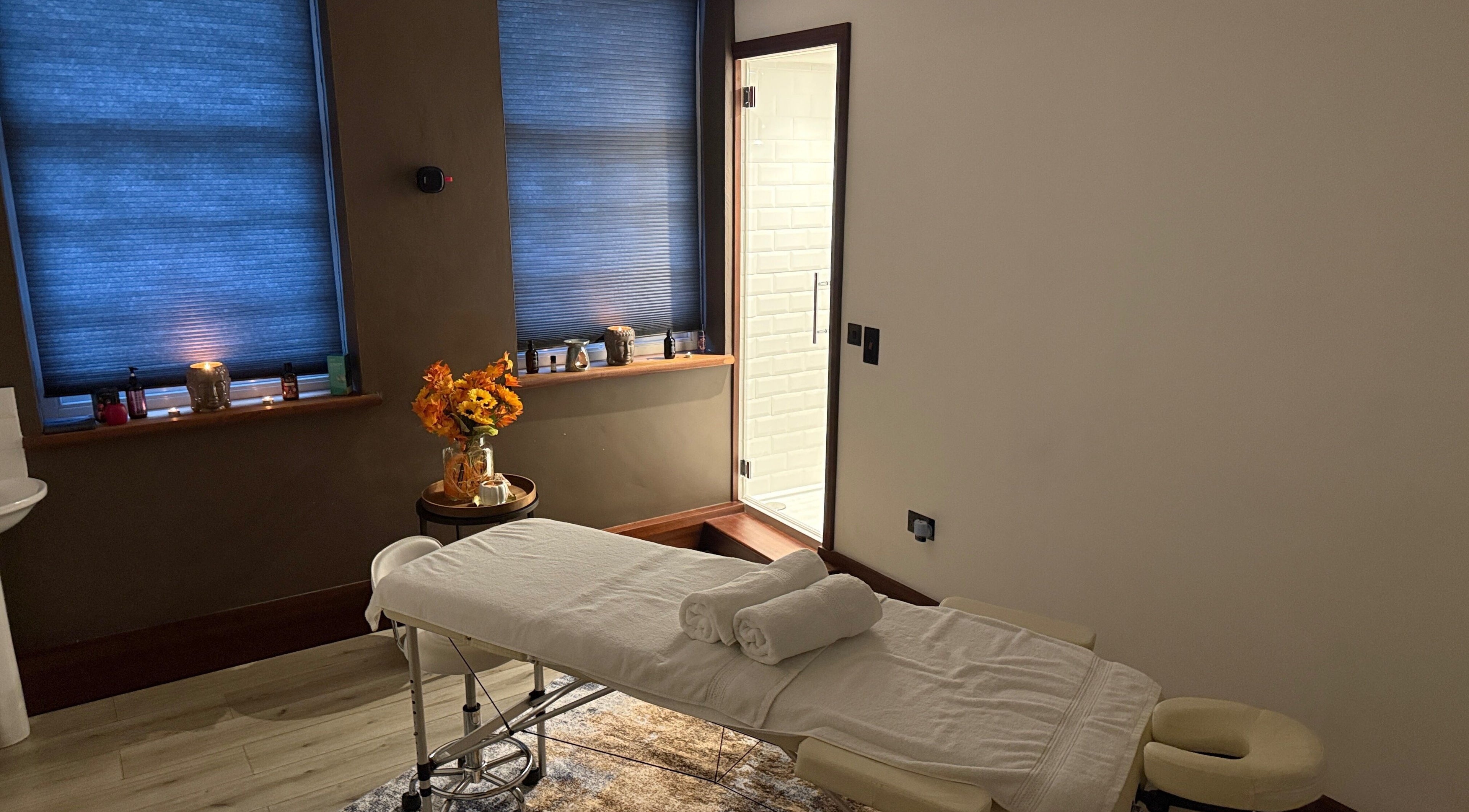 Cozy massage room with soft lighting at Elysium Massage Abergavenny, Abergavenny, Wales, GB.