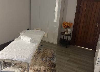 Tranquil massage room at Elysium Massage Abergavenny, Abergavenny, Wales, GB, featuring a cozy massage bed.