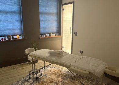 Elysium Massage Abergavenny's tranquil therapy room in Abergavenny, Wales, GB, featuring a cozy massage table.