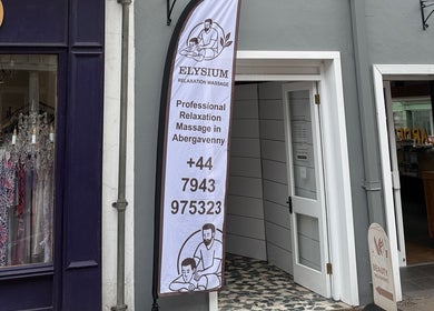Elysium Massage Abergavenny entrance with promotional banner. Located in Abergavenny, Wales, GB.