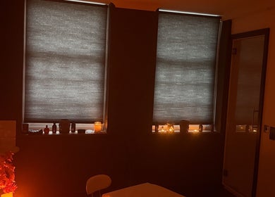 Cozy massage room with dim lighting and candles at Elysium Massage Abergavenny, Abergavenny, Wales, GB.