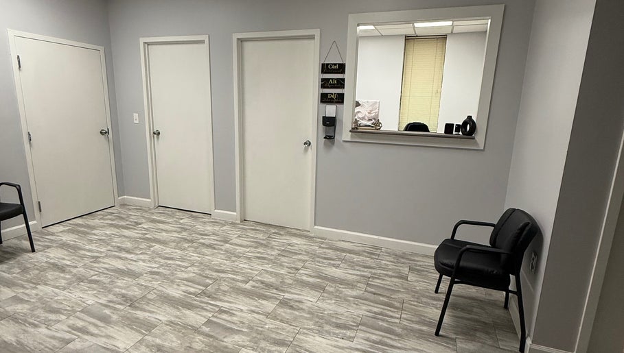 WETPARLOR's sleek reception area in Lanham, Maryland, US, featuring modern decor and comfortable seating.