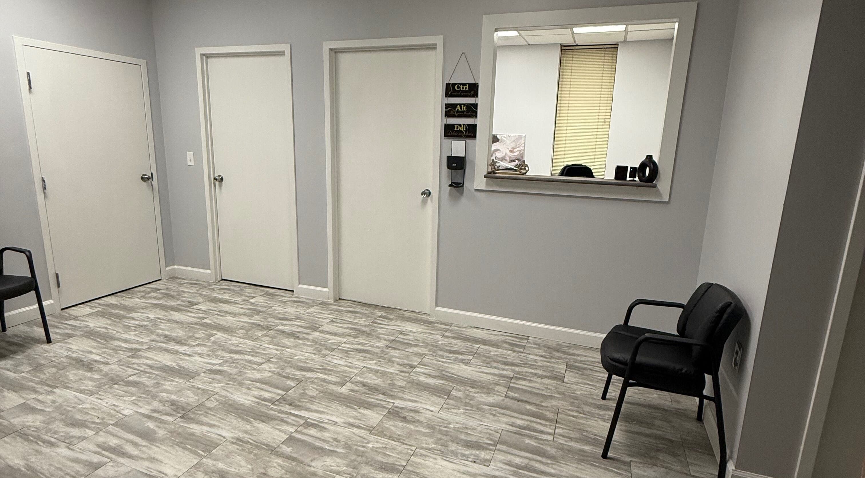 WETPARLOR's sleek reception area in Lanham, Maryland, US, featuring modern decor and comfortable seating.