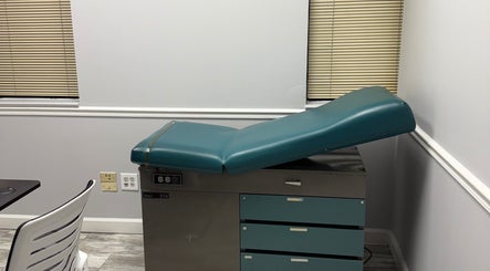 Modern treatment room at WETPARLOR, Lanham, Maryland, US, featuring an adjustable medical chair.