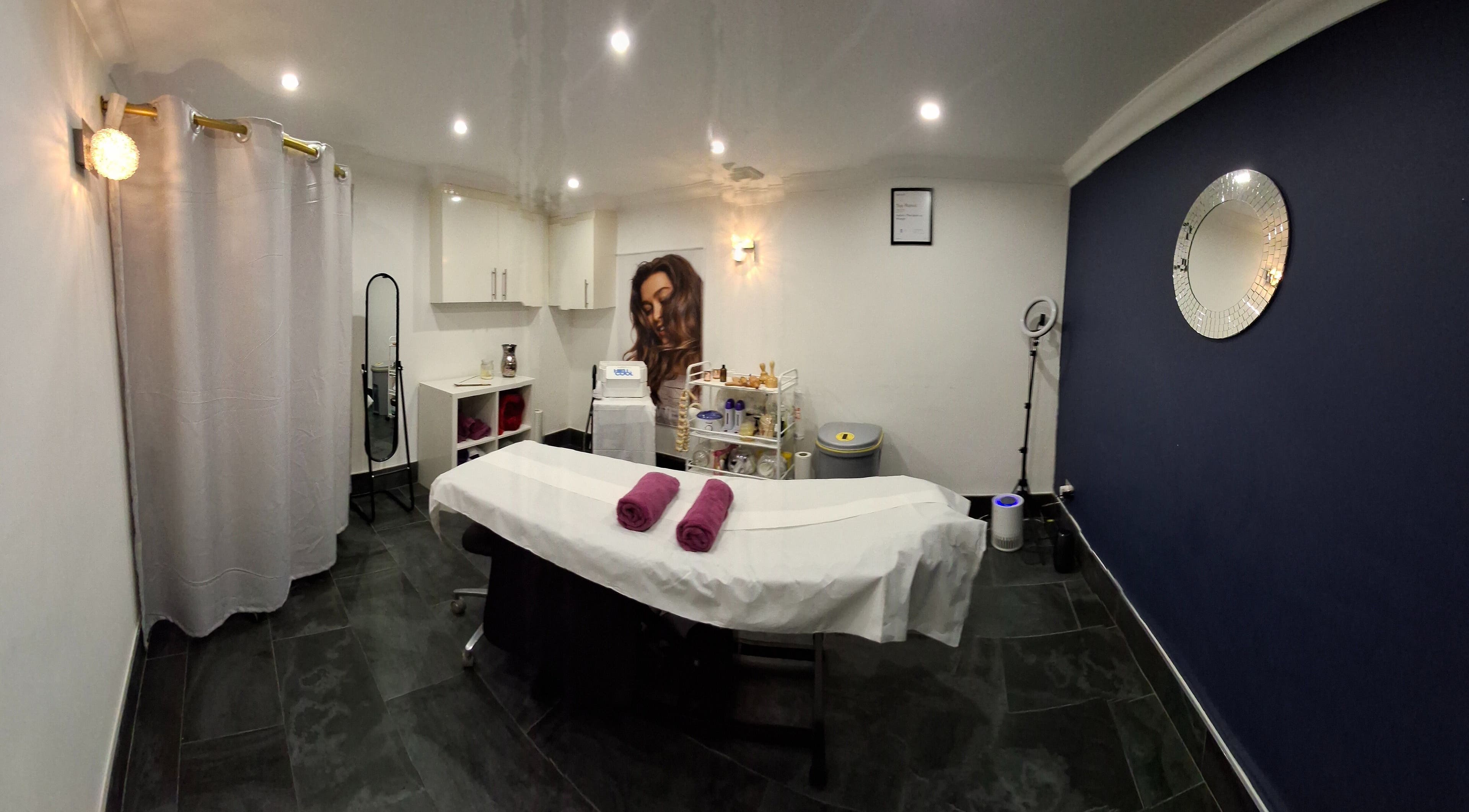 Relaxing treatment room at Facial & Body Contour by Zora, London, England, GB, featuring a massage bed.