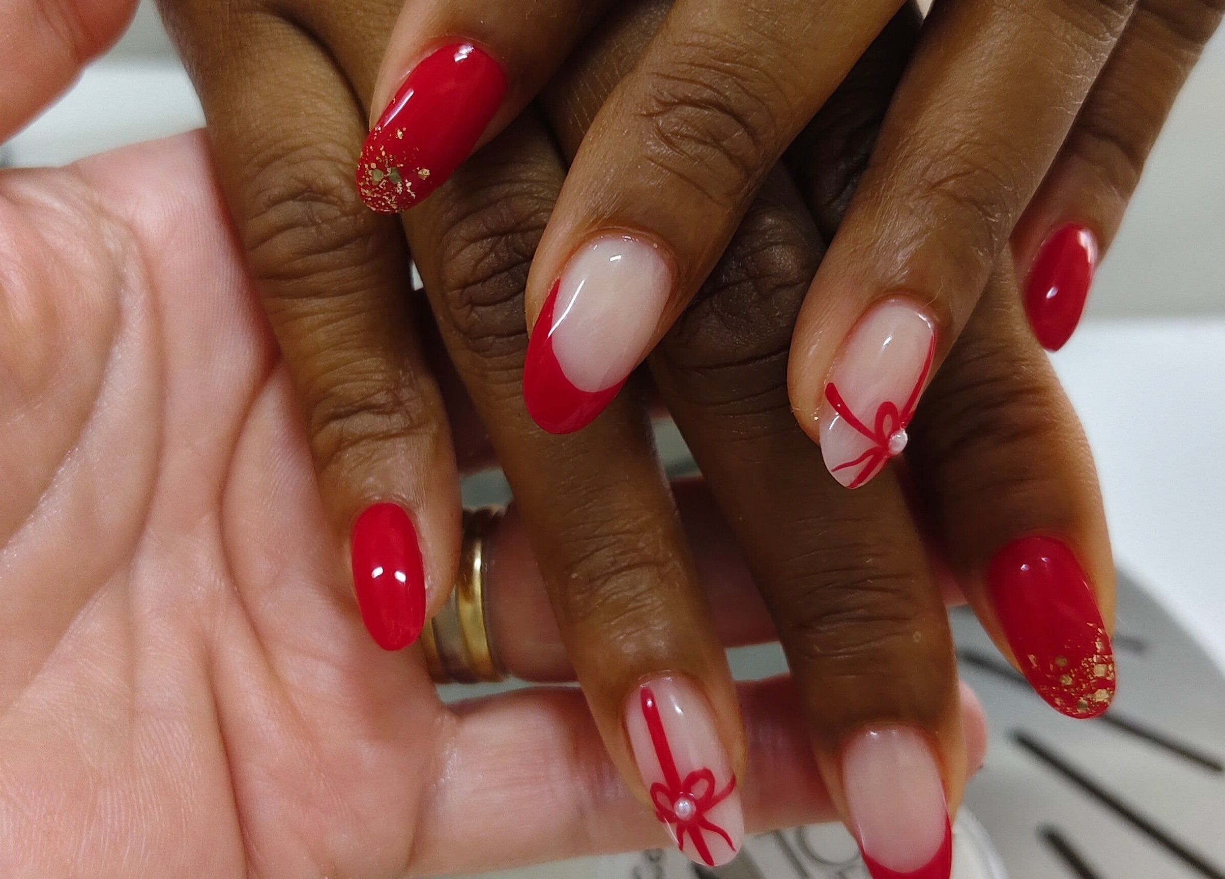 Red and gold nail art at Cosmopolitas Nails & Beauty Care, Willemstad, Curaçao, CW.