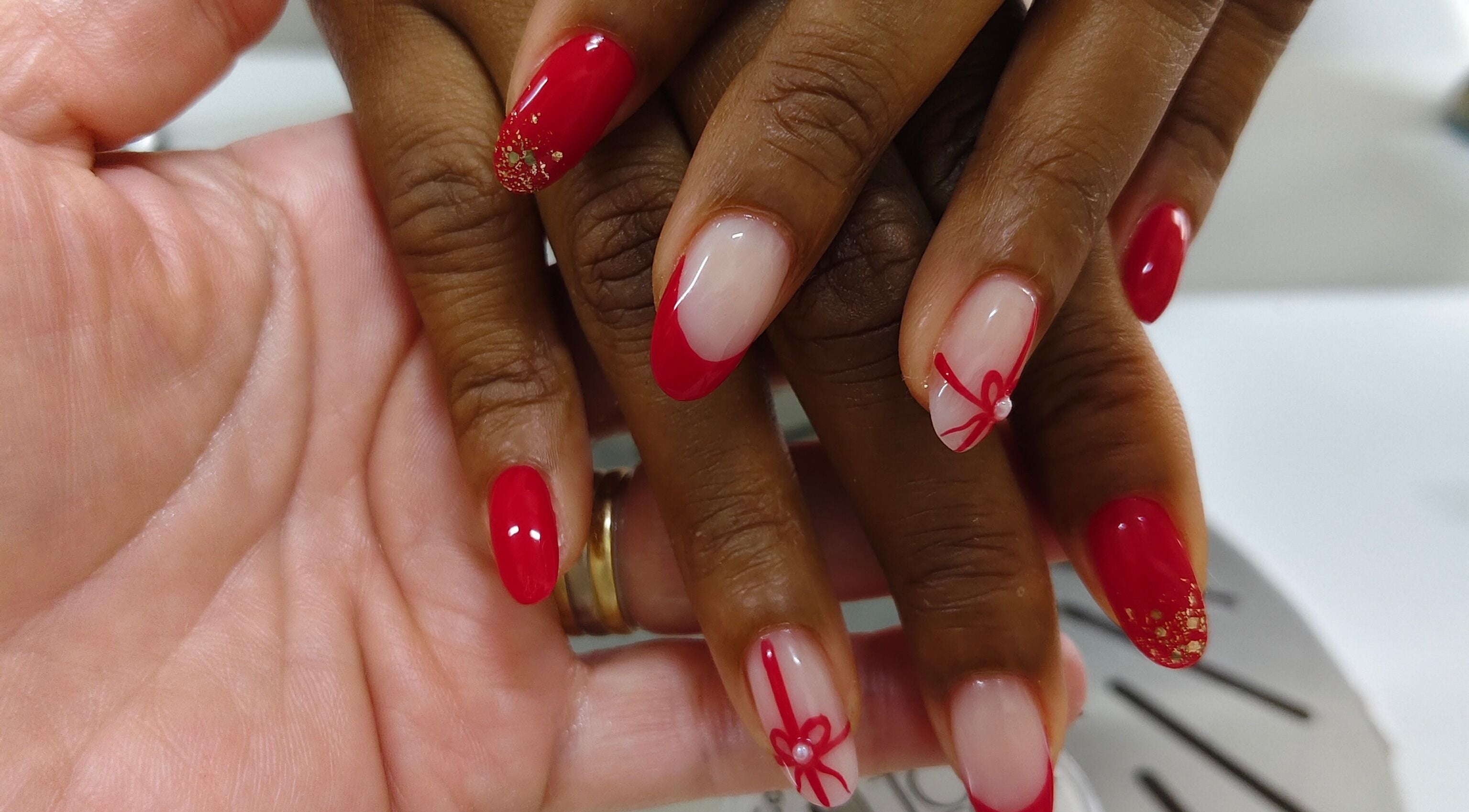 Red and gold nail art at Cosmopolitas Nails & Beauty Care, Willemstad, Curaçao, CW.