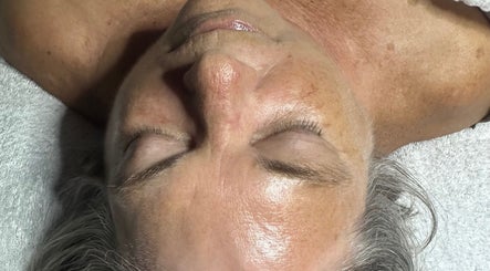 Close-up of a serene face at Beautifully Layered Skin, Kernersville, North Carolina, US, showcasing glowing skin.