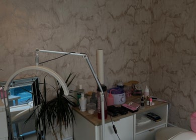Cozy treatment space at Harriet.Alice.Beauty in Alford, England. Features a lamp, plants, and beauty tools.