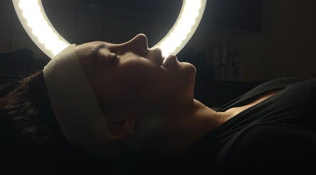 Facial treatment under ring light at Harriet.Alice.Beauty, Alford, England, GB.
