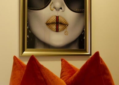 Stylish art decor with vibrant cushions at Beauty By Aimee, Dundee, Scotland, GB. Elegance meets creativity.