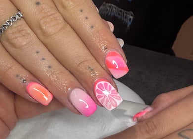 Bright citrus nail art at LAnails & beauty, Linlithgow, Scotland, GB. Featuring pink and orange designs.